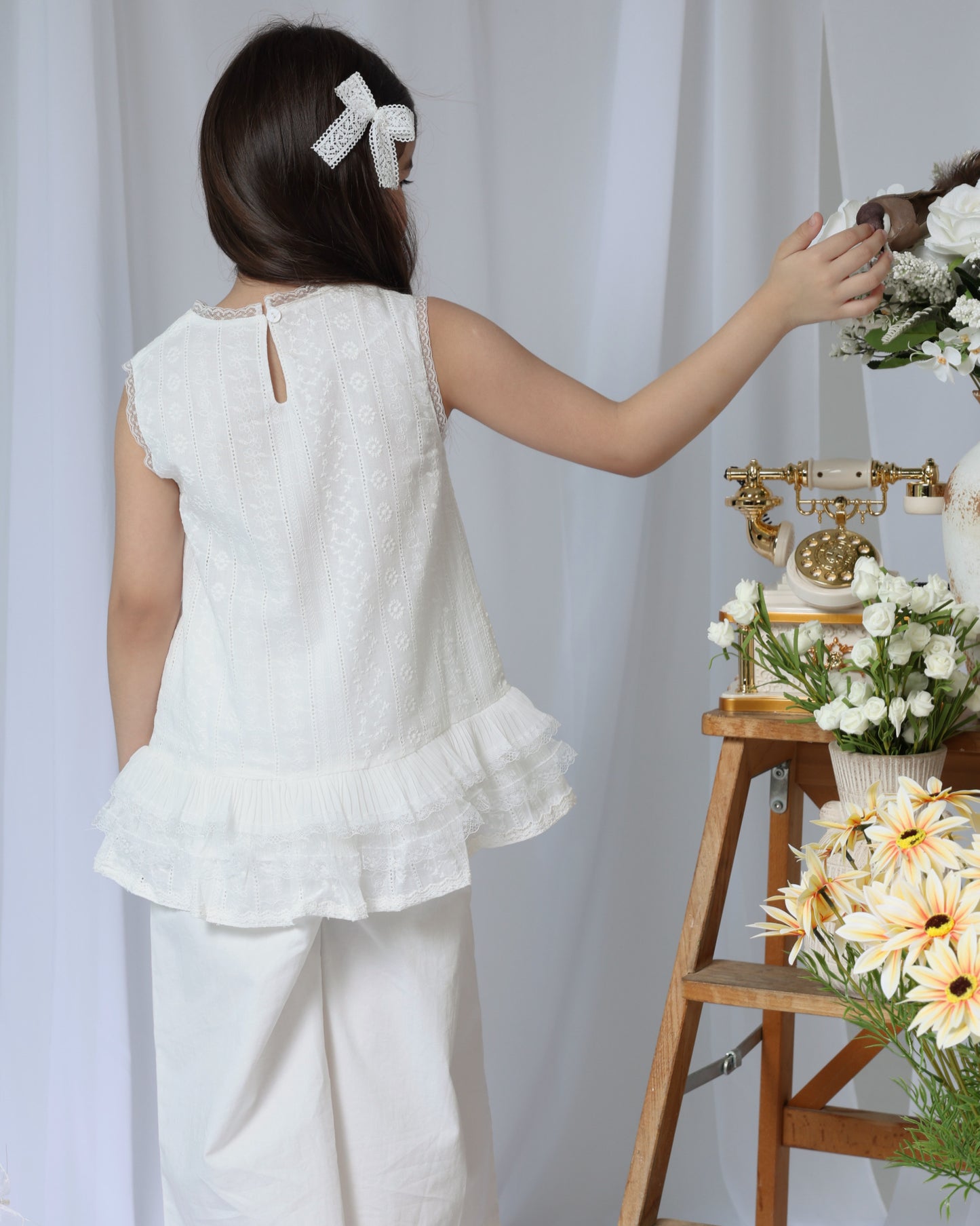 White sleeveless top