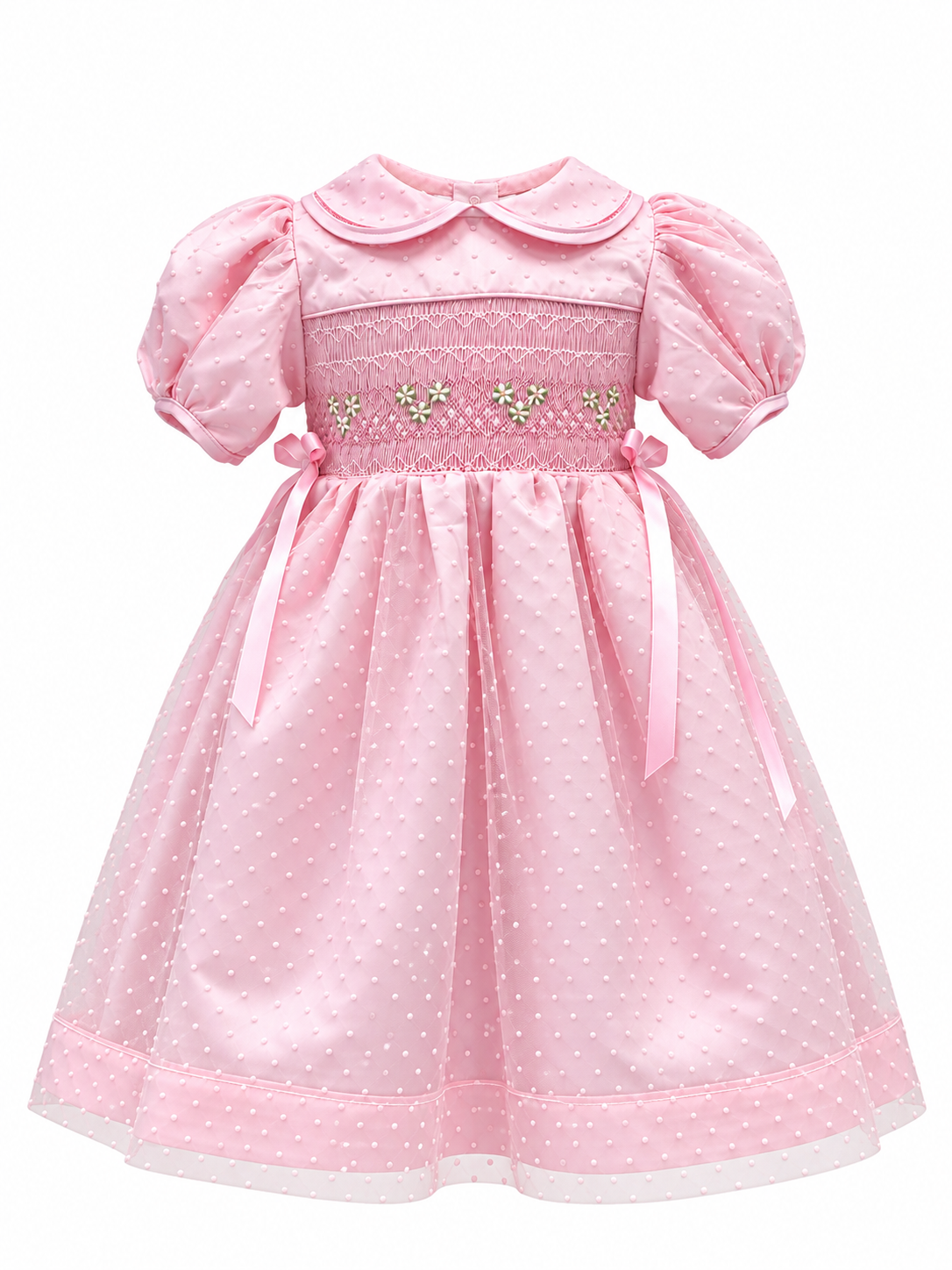 Pink smocked dress with polka dot tulle layer